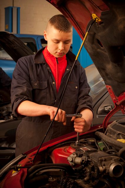 LEARNER WORKING ON CAR